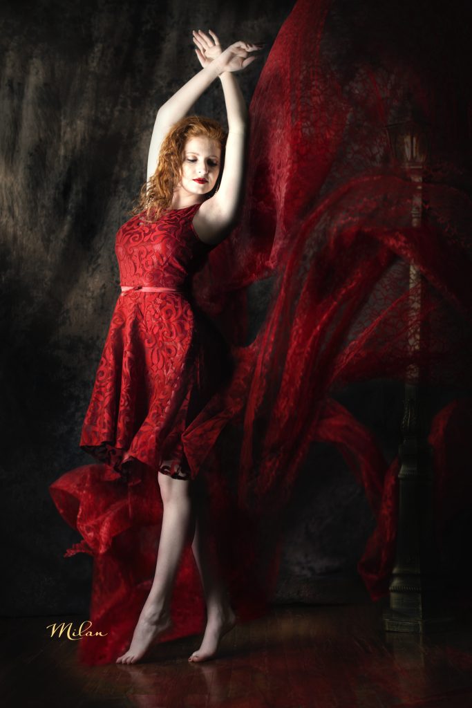 Girl in red dress dancing